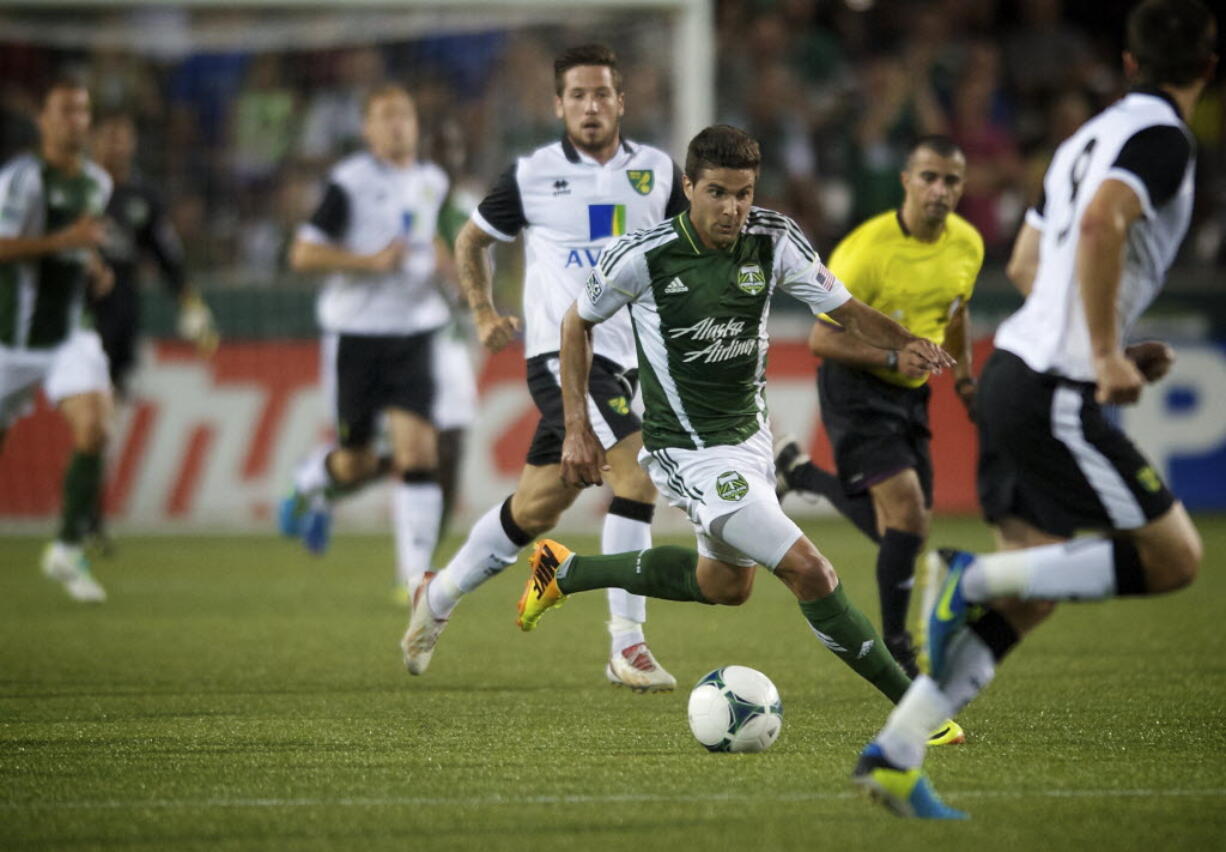 The Portland Timbers' Sal Zizzo take the ball up field against Norwich City in the second half at Jeld-Wen Field on Wednesday July 24, 2013.