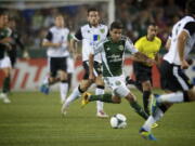 The Portland Timbers' Sal Zizzo take the ball up field against Norwich City in the second half at Jeld-Wen Field on Wednesday July 24, 2013.