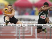 Prairie's Peter Zalk, left, clears the final hurdle in the boys 3A 110 high hurdles at the WIAA State Track &amp; Field meet Friday at Mount Tahoma High School in Tacoma.