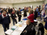 Veterans look for work at a job fair sponsored by WorkSource held at the new Armed Forces Reserve Center In Vancouver on November 17.