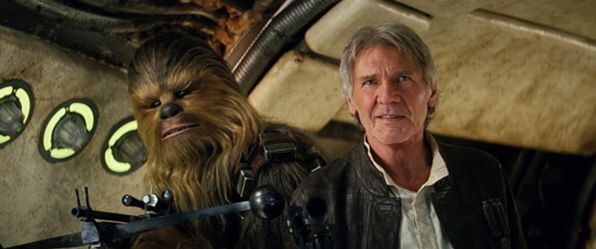 Peter Mayhew, left, as Chewbacca and Harrison Ford as Han Solo in &quot;Star Wars: The Force Awakens.&quot; The revival of the nearly 40-year-old space saga has already dominated the box office and toy shelves. Now, it&#039;s also been selected as The Associated Press Entertainer of the Year and is amassing support for Academy Awards consideration.