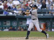 New York Yankees' Ichiro Suzuki swings on an RBI single in the third inning of a baseball game against the Seattle Mariners, Thursday, June 6, 2013, in Seattle. (AP Photo/Ted S.