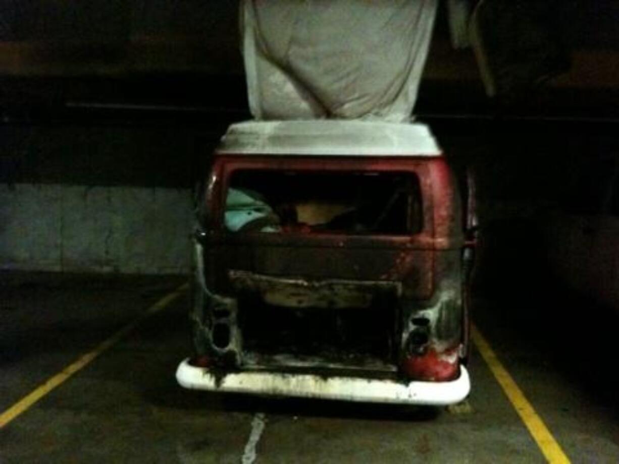 The remains of a Volkswagen van smolder inside the Vancouvercenter parking garage after a fire on Friday.