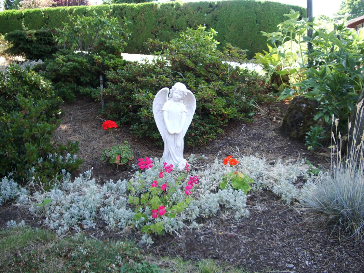 Fruit Valley: The Ernesti family is thankful for three angel statue gifts given to them after a story was featured in The Columbian and on TV news stations about a ceramic garden angel, pictured, that went missing from its front yard in December.