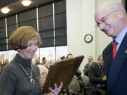 County Administrator Bill Barron gives former Clark County Commissioner Betty Sue Morris a plaque during Morris' retirement reception and 67th birthday celebration in December 2008.