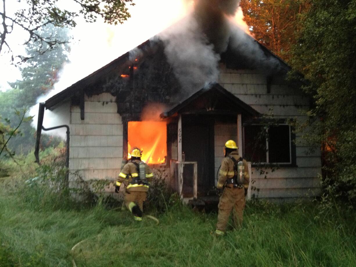 Firefighters quickly doused a fire that consumed an abandoned house in Battle Ground Friday morning.