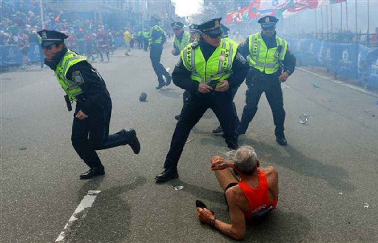 A photo of Bill Iffrig of Lake Stevens on the ground in front of three Boston police officers has been picked up by news sources internationally including The Telegraph, The Daily Mail and CNN.