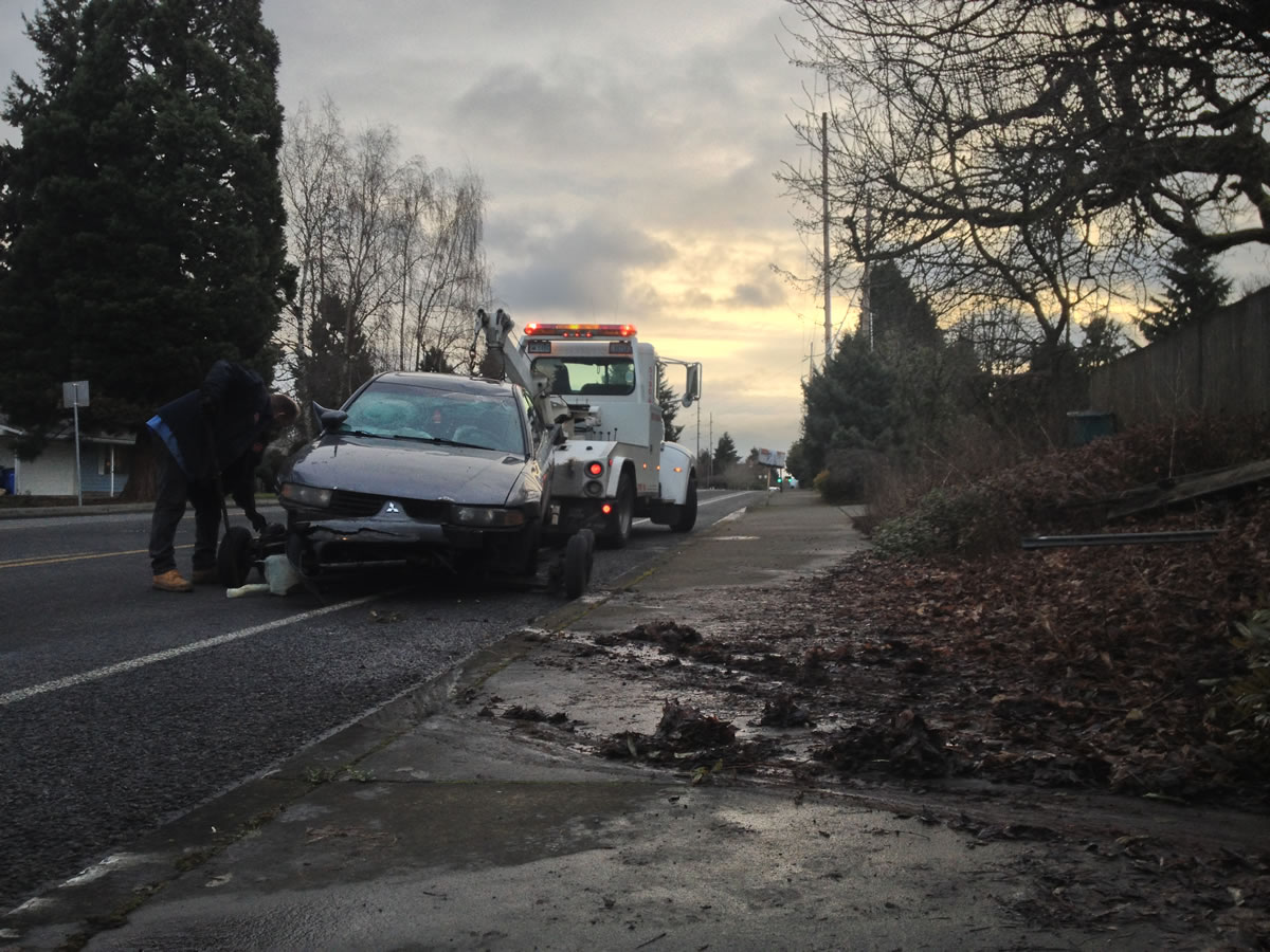 A car that crashed into a Hazel Dell house early Friday gets towed away from the scene.