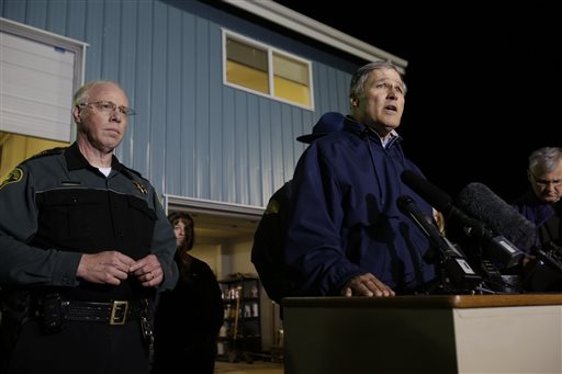 Washington Governor Jay Inslee, right, talks to reporters about the failure of the Interstate highway bridge crossing the Skagit River in Mt. Vernon Thursday May 23, 2013, dumping two vehicles into the water and sparking a rescue effort by boats and divers as three injured people were pulled from the chilly waterway.