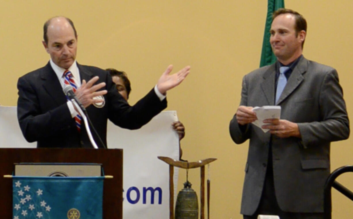 Democratic County Commissioner Steve Stuart, right, and Republican Auditor Greg Kimsey explained their proposal to reorganize county government at a lunchtime meeting of the Rotary Club of Vancouver on Wednesday.