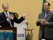 Democratic County Commissioner Steve Stuart, right, and Republican Auditor Greg Kimsey explained their proposal to reorganize county government at a lunchtime meeting of the Rotary Club of Vancouver on Wednesday.