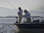 Jim Liddell, left, of Vancouver and Bud Hartman of Portland fish for bass near Government Island.