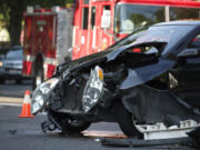 Firefighters respond to a minor injury car accident at the intersection of East Mill Plain Boulevard and Broadway Street Monday.