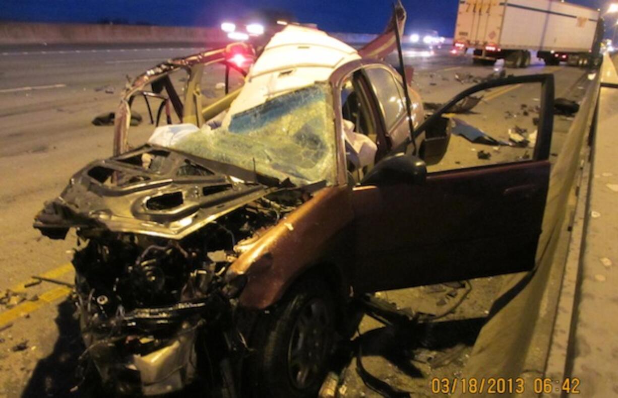 Shown here is the wreckage of the car driven by 24-year-old Katherine Mary Emerson of Vancouver who was injured early this morning in a collision with a tractor-trailer driven by Kenneth Eugene Burgess, 49, of Medical Lake. Burgess was later arrested on suspicion of driving under the influence after he drove his truck the wrong way on the southbound lanes of I-205.