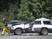 First responders work at the scene of a fatal accident on southbound Interstate 5 just south of the Woodland on Tuesday.