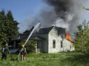 Fire destroys an abandoned house near the intersection of N.E.