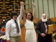 Ashley Cavner, 21, and Jessica Lee, 19, were the first gay couple to marry just after midnight at a mass wedding at Vancouver's First Congregational United Church of Christ.