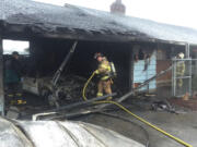 Firefighters stopped a blaze in a garage from spreading to the rest of the house Monday morning. The cause of the fire at  20507 N.E. 10th Ave. is under investigation.