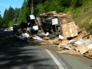 Rollover crash involving a tractor-trailer rig spilled 90,000 pounds of recycled cardboard.