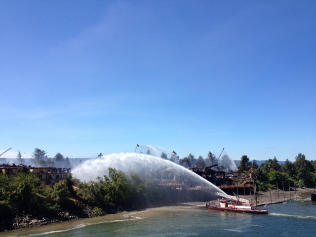 A fire boat helps put out the fire Sunday afternoon on the Columbia River.