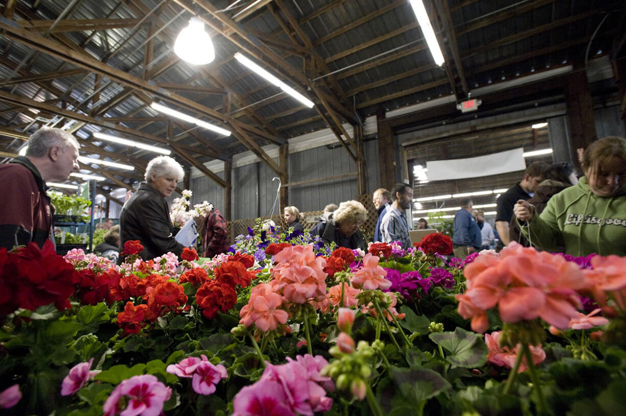 People attend the 2011 Clark Public Utilities Home and Garden Idea Fair at the Clark County Event Center, Saturday, April 30, 2011.