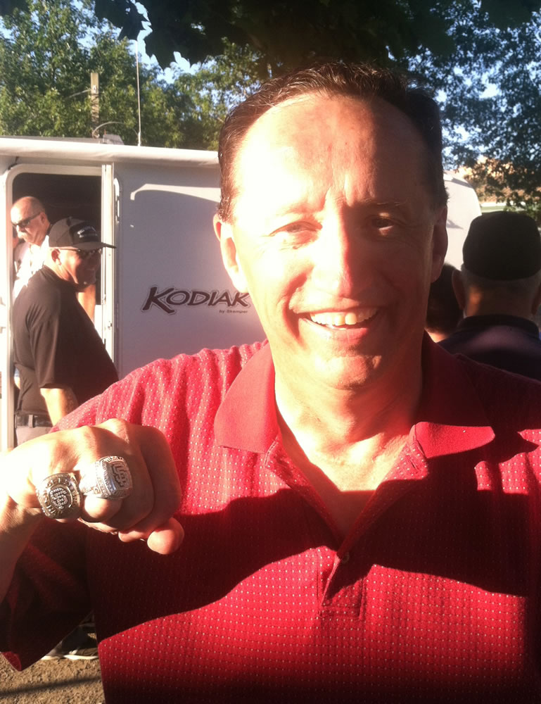 Jeff Iorg, San Francisco Giants chaplain, shows his two World Series rings.