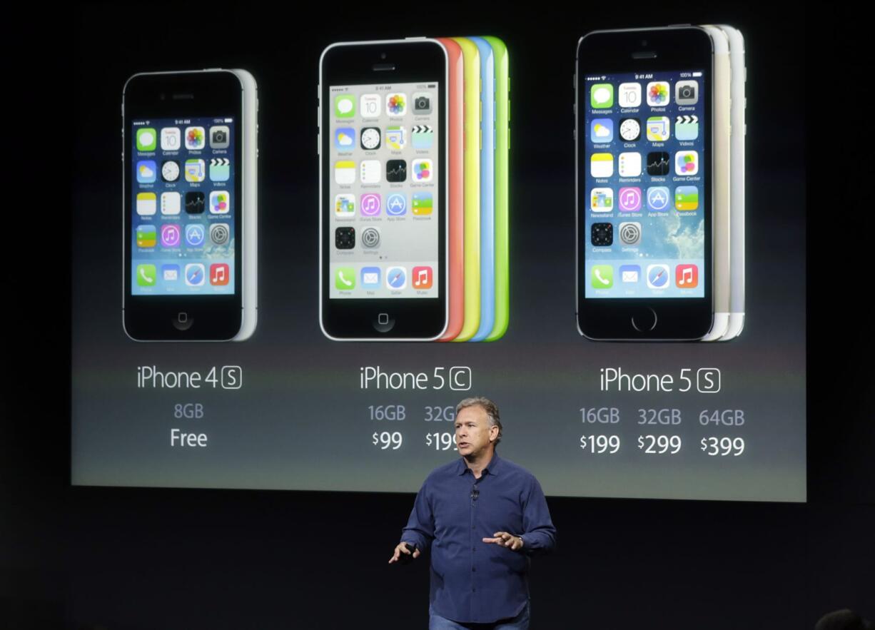 Phil Schiller, Apple's senior vice president of worldwide product marketing, speaks on stage during the introduction of the new iPhone 5c and 5s in Cupertino, Calif., Tuesday, Sept.