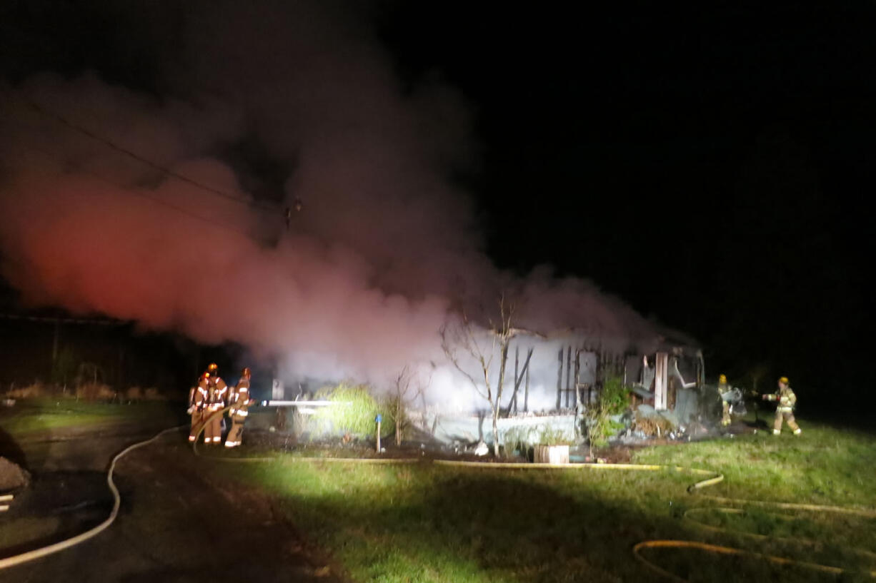 Fire officials are investigating what caused an early morning fire that destroyed a mobile home near Battle Ground Lake.