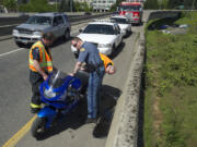 A rider was ejected off of his motorcycle after he crashed on the state Highway 14 overpass and landed on Interstate 5 just after 12:30 p.m.