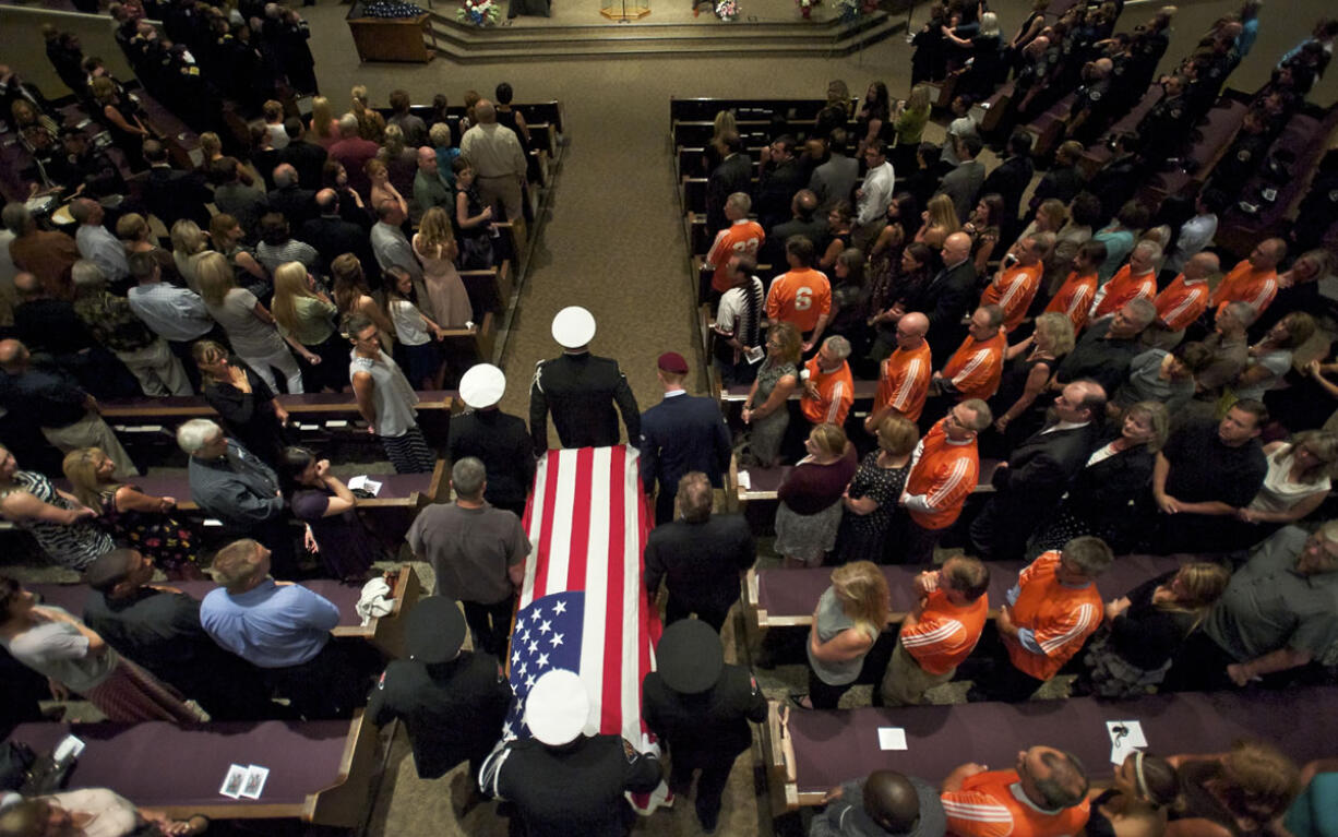 A procession and funeral services were held today for Carl Murray, a Vancouver firefighter who recently died of cancer.