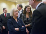 U.S. Sen. Patty Murray talks to WSUV President Mel Netzhammer, right, before  speaking at a CREDC quarterly event Thursday February 21, 2013 in Vancouver, Washington.