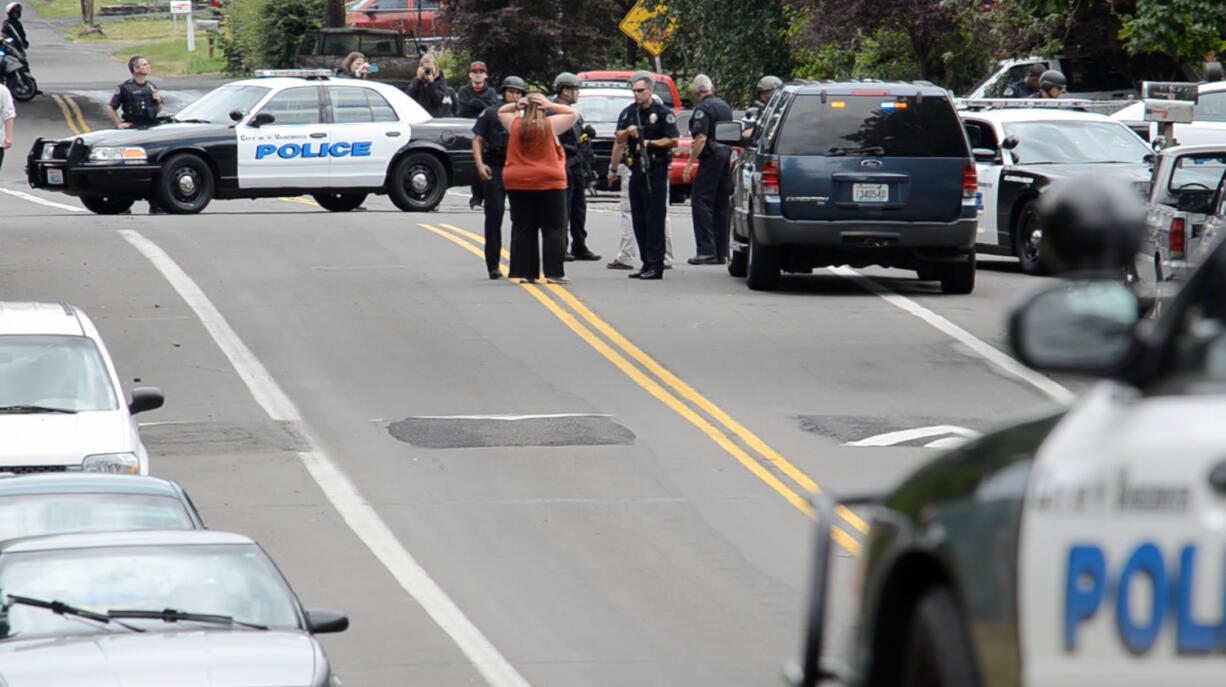 Police converge on the Rose Village area after a reported weapons disturbance.