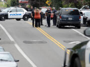 Police converge on the Rose Village area after a reported weapons disturbance.