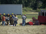 Firefighters respond to the crash of Hannibal Woodward's light plane at Pearson Field on June 27, 2012.