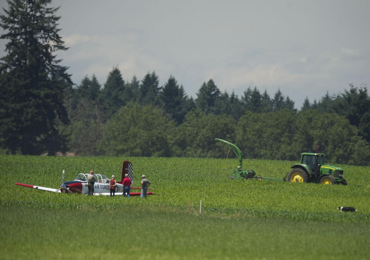 Two people escaped injury after making an emergency landing near Grove Field in Camas on Friday afternoon.