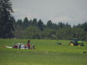 Two people escaped injury after making an emergency landing near Grove Field in Camas on Friday afternoon.