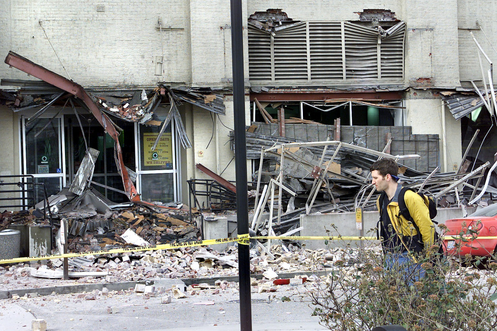 The Seattle Times files
A man walks by a damaged Starbucks in Seattle after the 2001 Nisqually earthquake. The magnitude 6.8 earthquake could be small compared with a potential quake in the Cascadia fault zone. The zone created a magnitude 9.0 earthquake when it last ruptured in 1700.