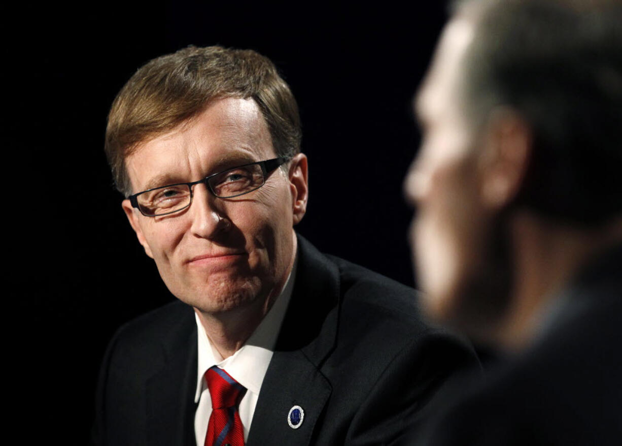 Then-Washington gubernatorial candidate Republican Rob McKenna looks at Democrat Jay Inslee during their final debate in Seattle in 2012.