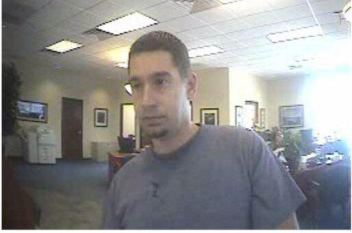 Deputies are searching for this man, who reportedly demanded money from a Hazel Dell bank and left with an undisclosed amount of cash this morning.