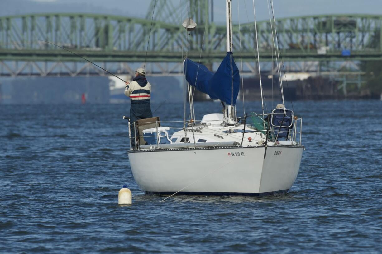 A pair of anglers tried for fall chinook salmon on Tuesday from an anchored sailboat near the Interstate 5 Bridge.