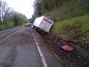 A semi-trailer truck that crashed into a pole on state Highway 14 near east of Washougal has blocked westbound traffic on the highway.