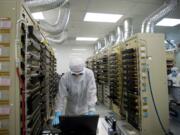 An nLight technician monitors temperature while running a test inside the test department at the Vancouver-based company.