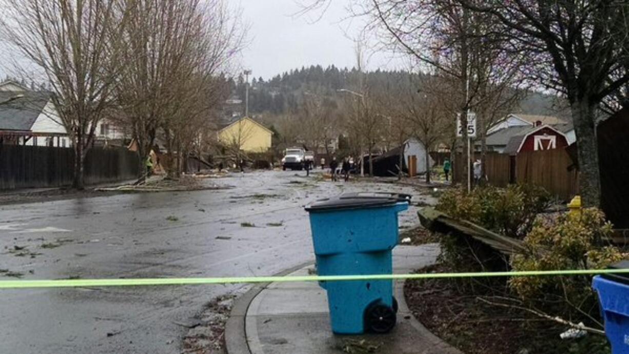 Crews respond to damage reportedly caused by a tornado in the Battle Ground Village area this morning.