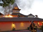 Firefighters respond to Who Song &amp; Larry's Restaurant and Cantina after fire broke out during the dinner rush at the waterfront business on Wednesday.