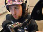 Aaron McPherson, also known as “DJMC,” is a DJ at Washington State University Vancouver’s KOUG radio station. The station is broadcast exclusively online and staffed by students.