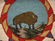 The image of a bison is created by intricate beading on a flat bag made during the 1930s. It is part of a new exhibit at the Clark County Historical Museum in Vancouver. Top: A selection of beaded pouches that date back to the late 1800s are on display at the historical museum.