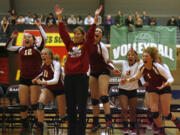 Prairie head coach Andrea Doerfler and the bench celebrates as the Falcons score the match-winning point in their three-game sweep of North Thurston in the 3A volleyball state championship match at Saint Martin&#039;s University in Lacey on Saturday, Nov. 10, 2012. (TONY OVERMAN/Staff photographer) Prairie&#039;s Karlee Lubenow (9) battles North Thurston&#039;s Megan Kramer at the net during the 3A volleyball state championship match at Saint Martin&#039;s University in Lacey on Saturday, Nov. 10, 2012.