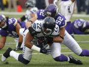 Vikings linebacker Chad Greenway (52) tackles Seahawks running back Fred Jackson (22) during the teams&#039; meeting in Minneapolis last month.