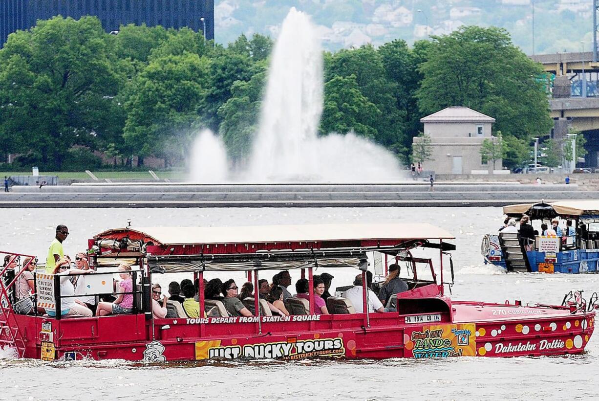 The Just Ducky fleet with a full load of tourists makes its turn in the Ohio River in Pittsburgh to head back to shore during a morning tour.