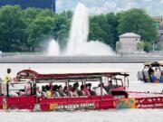 The Just Ducky fleet with a full load of tourists makes its turn in the Ohio River in Pittsburgh to head back to shore during a morning tour.